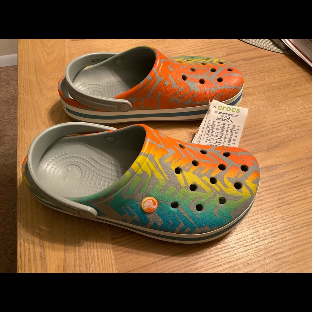 Crocs- colorful.    Orange yellow Green blue gray